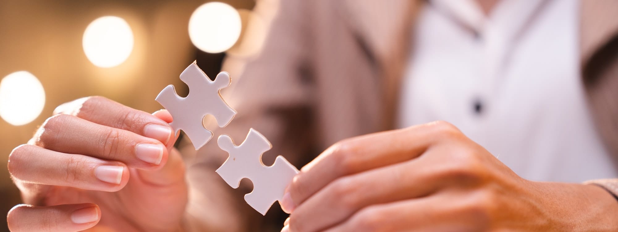 Concept of integration and startup with puzzle pieces merger with teamwork of business worker